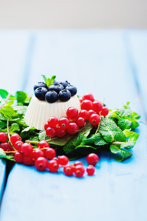 Vanilla panna cotta with fresh berriesの写真素材