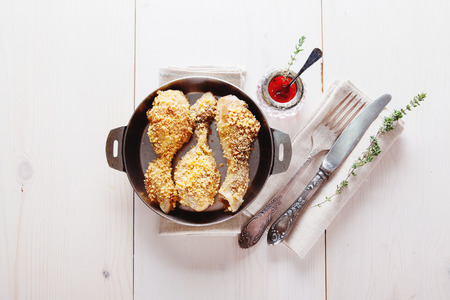 Fried chicken with tomato and thyme sauce closeupの写真素材