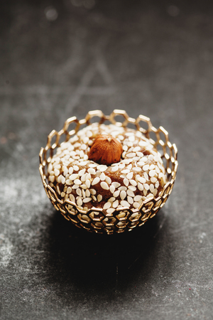 Raw vegan sweet candy ball with sesame and hazelnutの写真素材