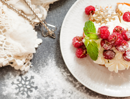 Raspberry Cake with whipped cream on pink background close upの写真素材
