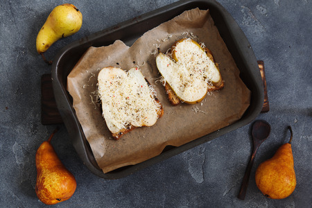 Whole grain baked sandwich with peanut butter, cheese and pears, top viewの写真素材