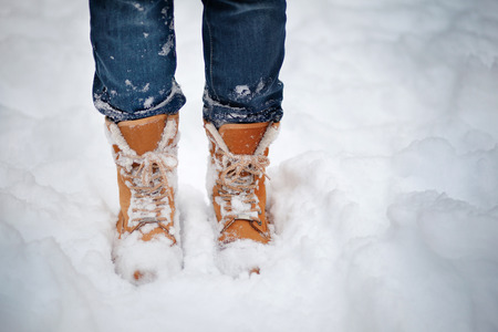 Boots in the snow, woman's boots walking snow weather in Russia copy spaceの写真素材