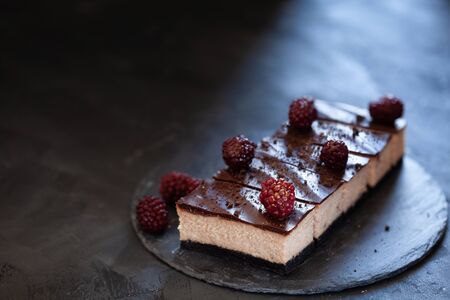Cheesecake with chocolate glaze, summer dessert close upの写真素材