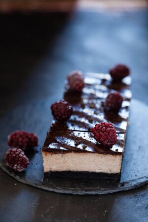Cheesecake with chocolate glaze, summer dessert close upの写真素材