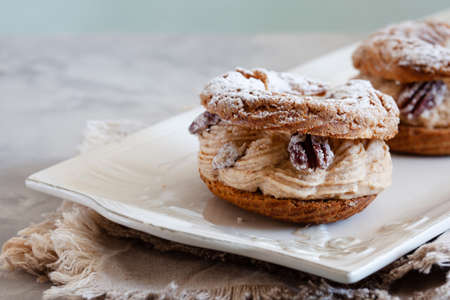Classic French dessert Paris Brest, choux pastry filled with soft hazelnut creamの写真素材