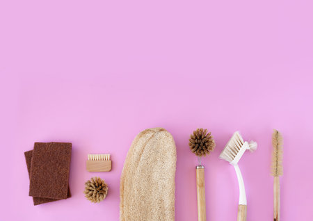 Natural cleaning accessories flat lay, featuring bamboo brushes and organic spongesの写真素材