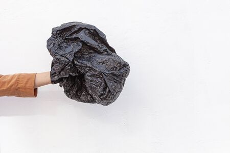 Concept of stop plastic pollution, global warming, recycling plastic, plastic free. Hand holding a...