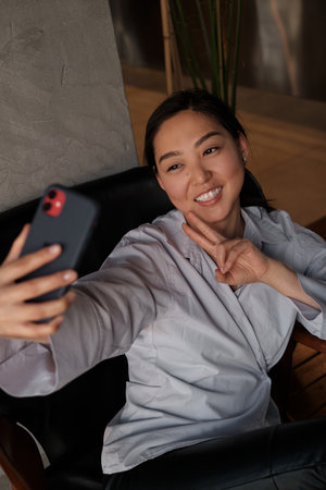A woman take selfie. Asian korean woman live blogger online. Technology communication people conceptの写真素材