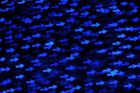 Beautiful holiday background with blue arrows  defocused lightsの写真素材