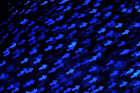 Beautiful holiday background with blue arrows  defocused lightsの写真素材