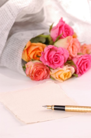Beautiful bouquet of roses wraped in a newspaperの写真素材