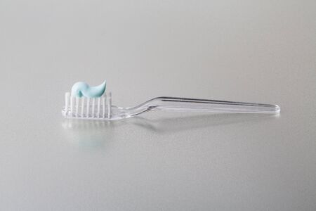 White small tooth brush with paste ready to useの写真素材