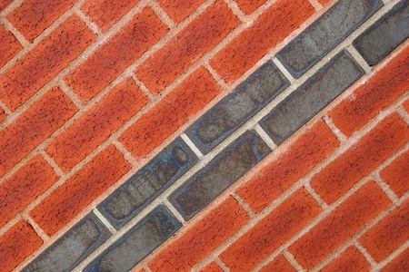 Red and dark grey bricks on a diagonal axis.の写真素材