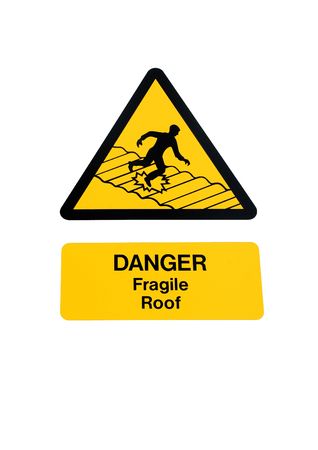 Fragile roof warning sign in yellow and black, isolated over white.の写真素材