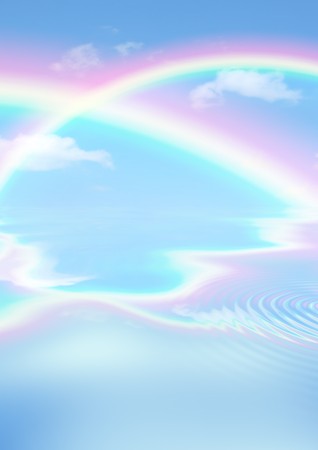 Fantasy abstract of double rainbows against a blue sky with reflection over rippled water.の写真素材
