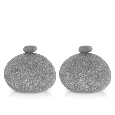Zen abstract of two large round and small grey stones in perfect balance over white background.の写真素材