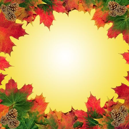 Maple leaf and pine cones with gold sparkles in an abstract design forming a border, over pastel yellow background with white central glow.の写真素材