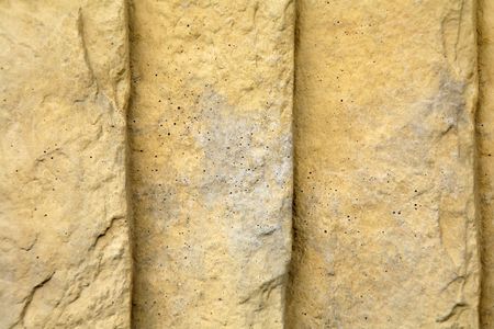 Ridged and textured golden colored  sandstone background.の写真素材