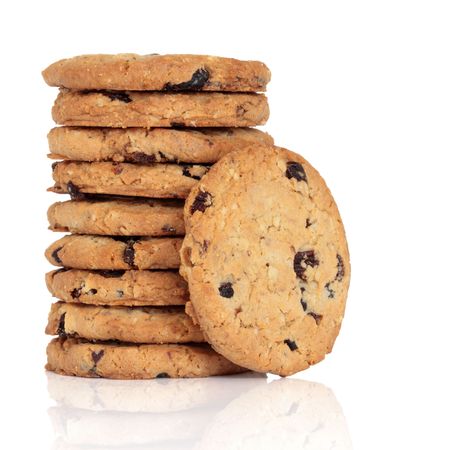 Blueberry and oat cookies isolated over white background with reflection.の写真素材