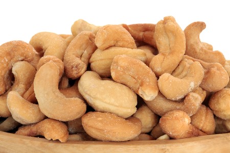 Cashew nuts over a white background.の写真素材