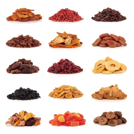 Large collection of dried and candied fruit for snacks and culinary use, isolated over white background.の写真素材
