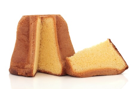 Pandoro italian christmas cake with a slice taken out, isolated over white background.の写真素材