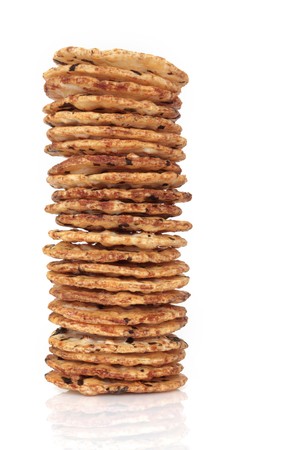 Japanese seaweed rice cracker stack isolated over white background.の写真素材