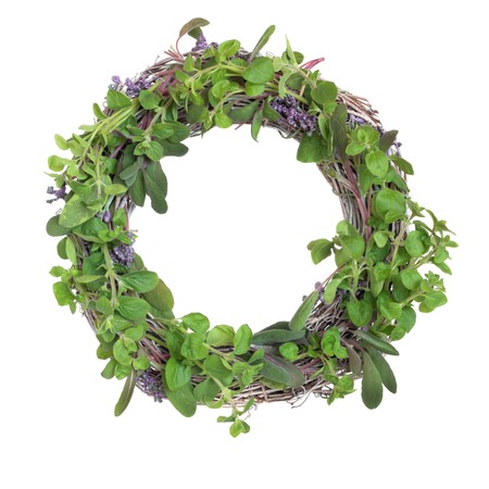 Herb leaf garland with purple and variegated sage, oregano, basil and lavender flowers, isolated over white background.の写真素材