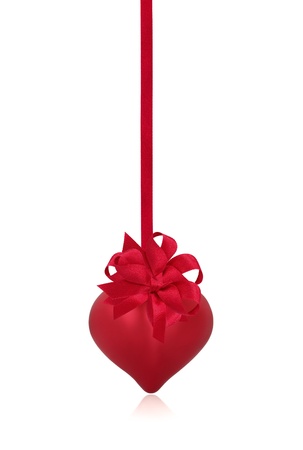 Red valentines heart with red ribbon and bow, isolated over white background.の写真素材