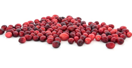 Cranberry fruit loosely scattered isolated over white background.の写真素材