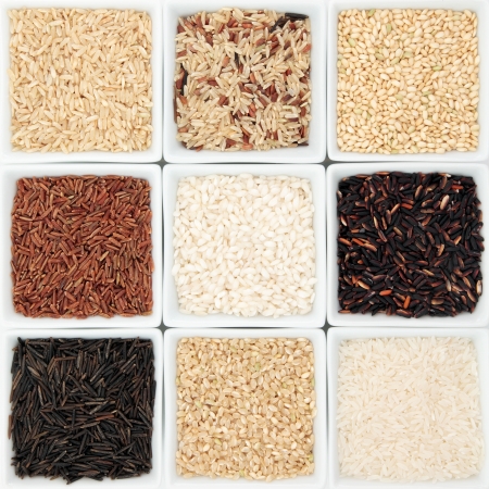 Rice grain selection in white porcelain bowls の写真素材