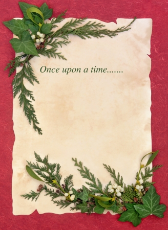 Christmas abstract floral border with once upon a time storyline over old parchment and red background    の写真素材