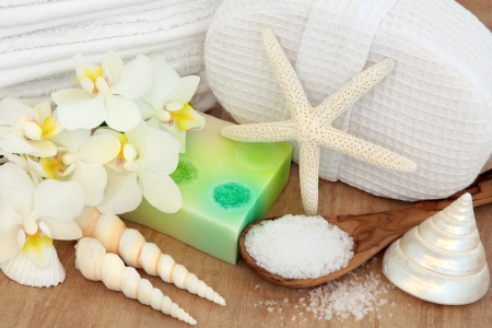 Spa and bathroom accessories with orchid flowers, sea salt, soap and shells の写真素材