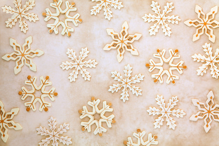 Old wooden christmas snowflake abstract design over mottled background の写真素材