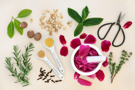 Love potion ingredients over mottled cream background.の写真素材