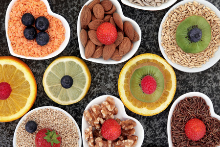 Health food selection in porcelain bowls over marble background.の写真素材