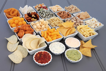 Savoury snack and dip food selection in porcelain dishes.の写真素材