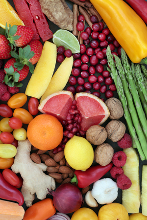 Healthy diet food with fruit and vegetable selection. Superfood concept high in antioxidants, anthocyanins, vitamins fiber and minerals, top view.の写真素材