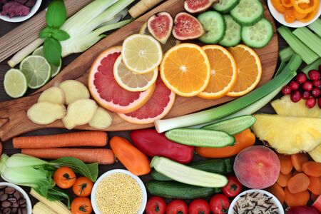 Super food for losing weight concept with fruit, vegetables, grains and spice with health foods high in antioxidants, anthocyanins, vitamins & dietary fibre.の写真素材