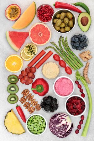 Health food for a healthy heart and cardiovascular system with fruit, vegetables, spices, dips and nuts. High in omega 3, antioxidants, protein, anthocyanins and fibre with a low GI. Flat lay.の写真素材