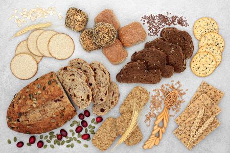 High fibre food for good health concept with bread, crackers, seeds and grain.の素材 [FY310143530341]