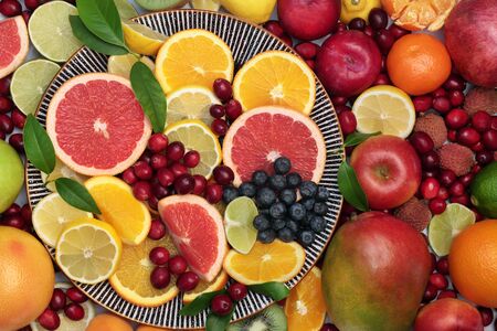 Large healthy  immune boosting fresh fruit collection on a round plate and loose. Super food very high in antioxidants, vitamins, dietary fibre and anthocaynins. Flat lay, top view.の写真素材