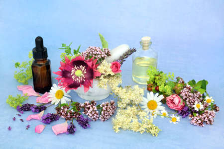 Essential oil preparation for use in aromatherapy and natural herbal medicine with summer flowers &...