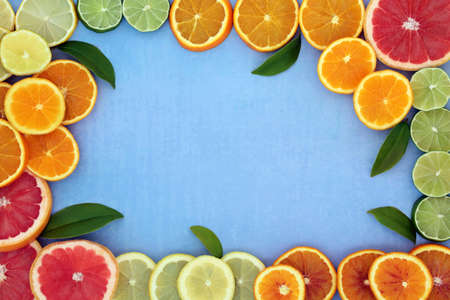 Healthy high fibre citrus fruit border for immune boost with oranges, lemons, limes & grapefruit,...