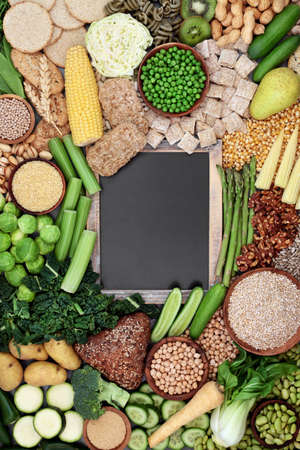 Natural high fibre vegan plant based  health food for digestive health products high in antioxidants, protein, omega 3. Healthy planet and healthcare  concept. Blackboard copy space.の写真素材