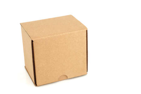 Cardboard box container cube shape brown with lid closed on white background. Recycling, e commerce,...