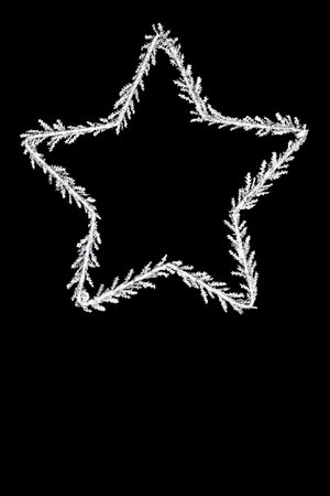 Christmas Star of Bethlehem concept glitter symbol decoration on black. Traditional festive ornament for the Xmas and New Year holiday.の写真素材