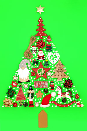 Christmas tree shape decoration with rustic retro old fashioned bauble decorations and snowflakes,. Eco friendly design for Xmas and New Year holiday season on vivid green background.の写真素材