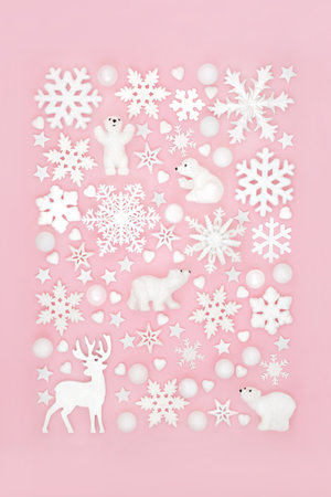 Christmas reindeer, polar bear and snowflake north pole festive design on pink background. Fun symbols for winter Xmas Eve and New Year holiday season.の写真素材