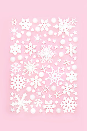 Christmas snowflake festive background design with star and heart shape decorations. Traditional symbols for winter, Xmas and New Year holiday season.の写真素材